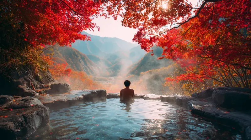 美しい紅葉に囲まれた露天風呂を楽しむ男性
